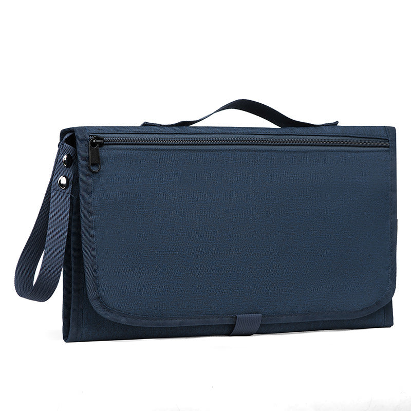 Trocador de fralda impermeável, dobrável e portátil.